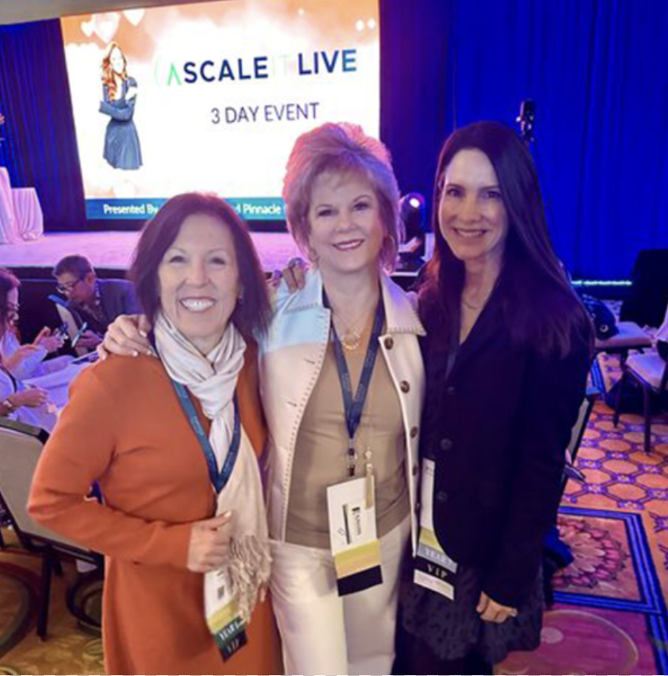 Dana C. Arnett with Robin Richter of Wearable Imaging and Missy Kelly of CatTongue Grips at Pinnacle Global Network Scale It Live event